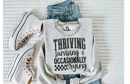 Thriving Surviving and Occasionally Crying